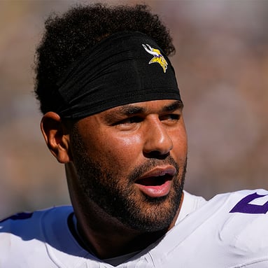 Headshot of Kamu Grugier-Hill